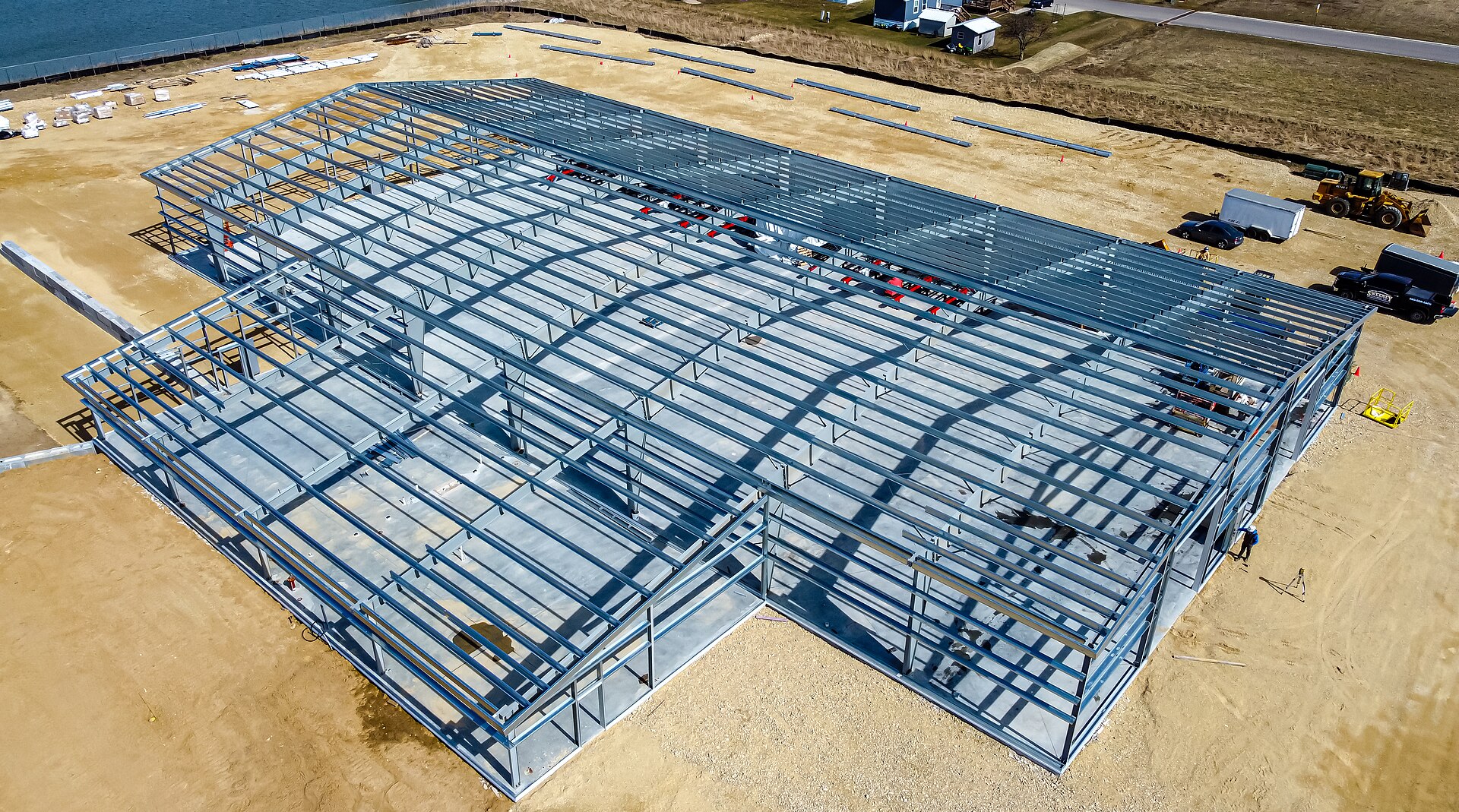 A steel building frame of columns and beams, before the walls go on